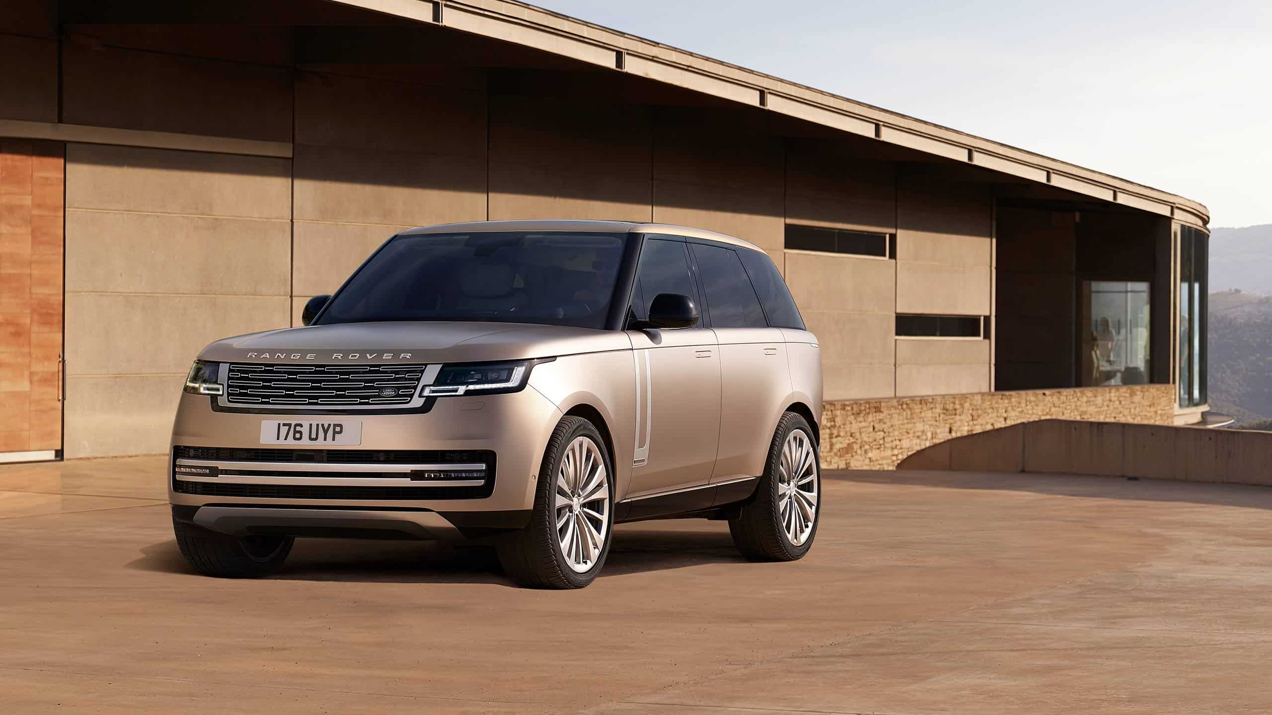New Range Rover in gold front side view