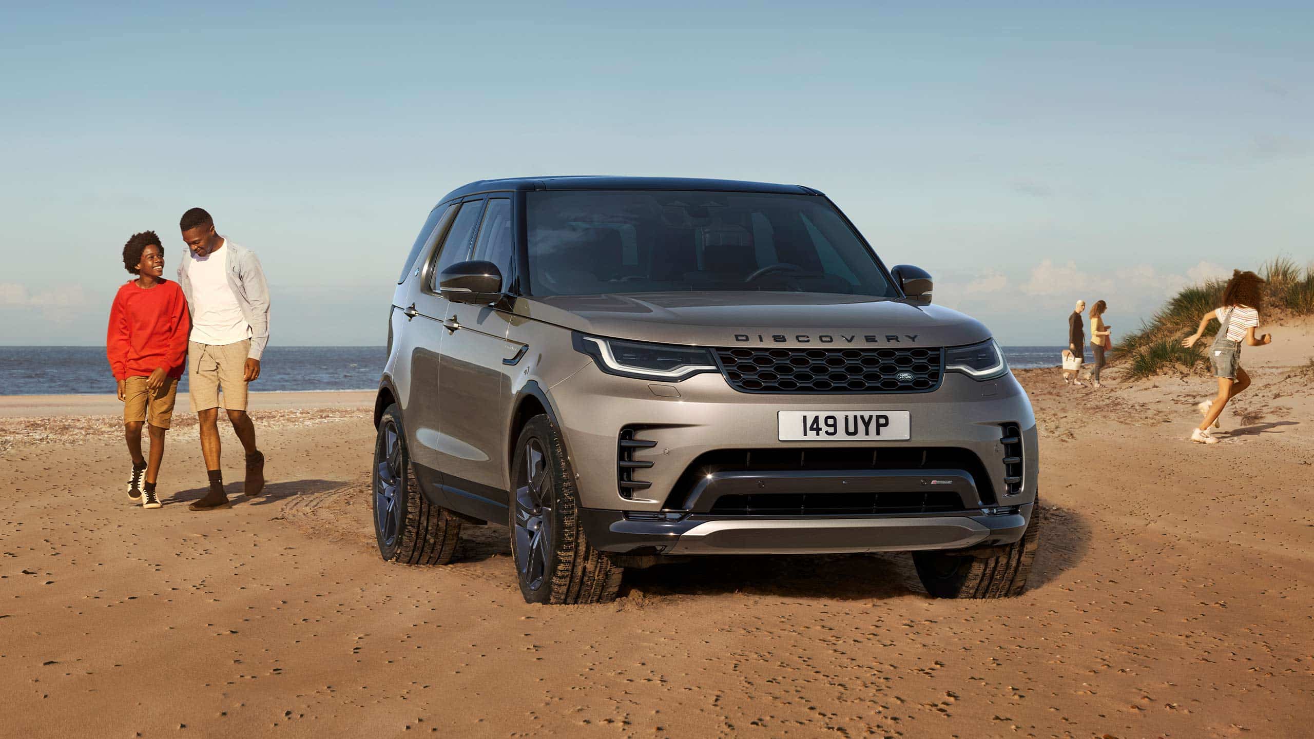 Family Picnic On A Beach Side With Discovery