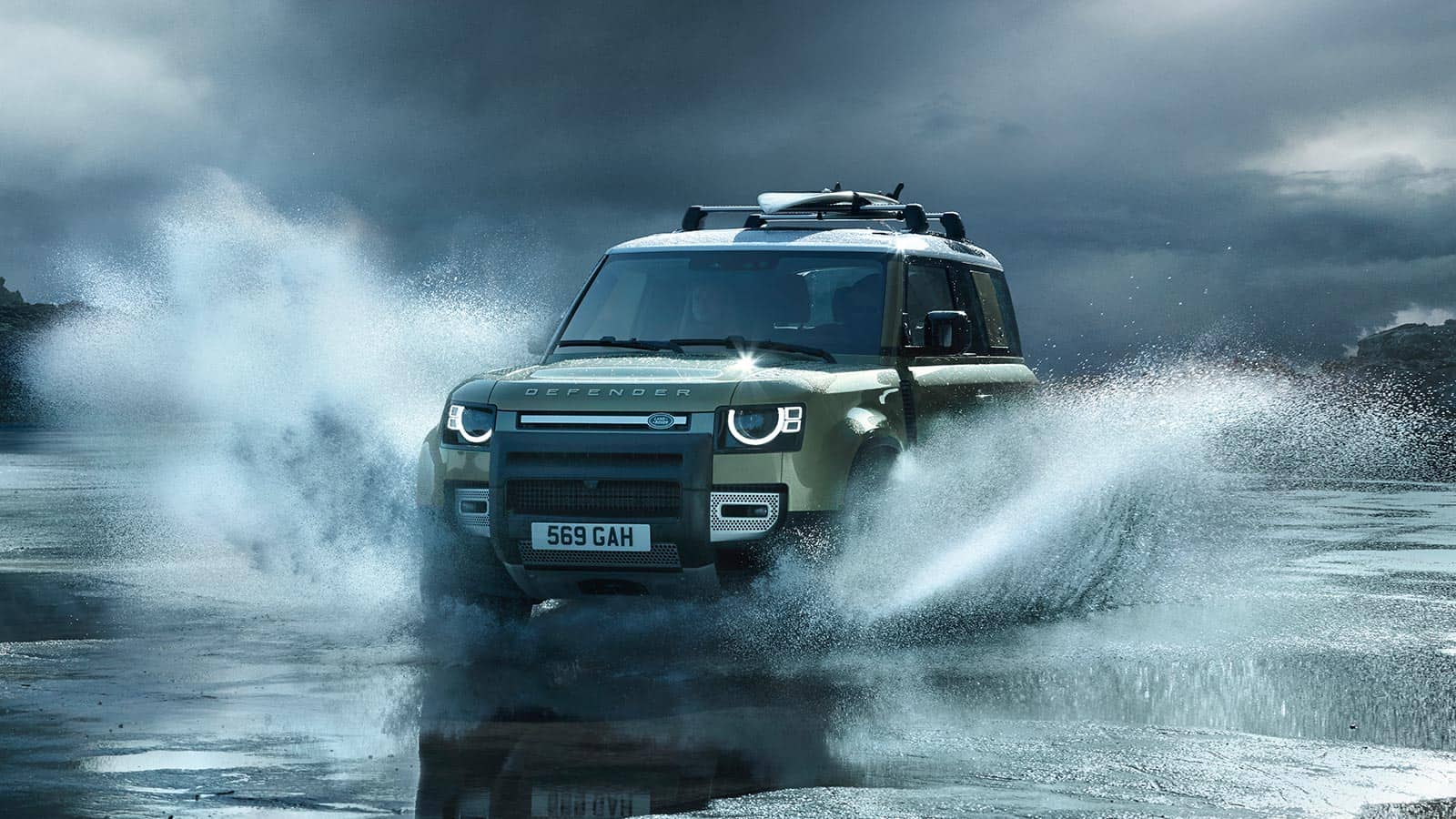Man is Driving Defender At High Speed On seawater