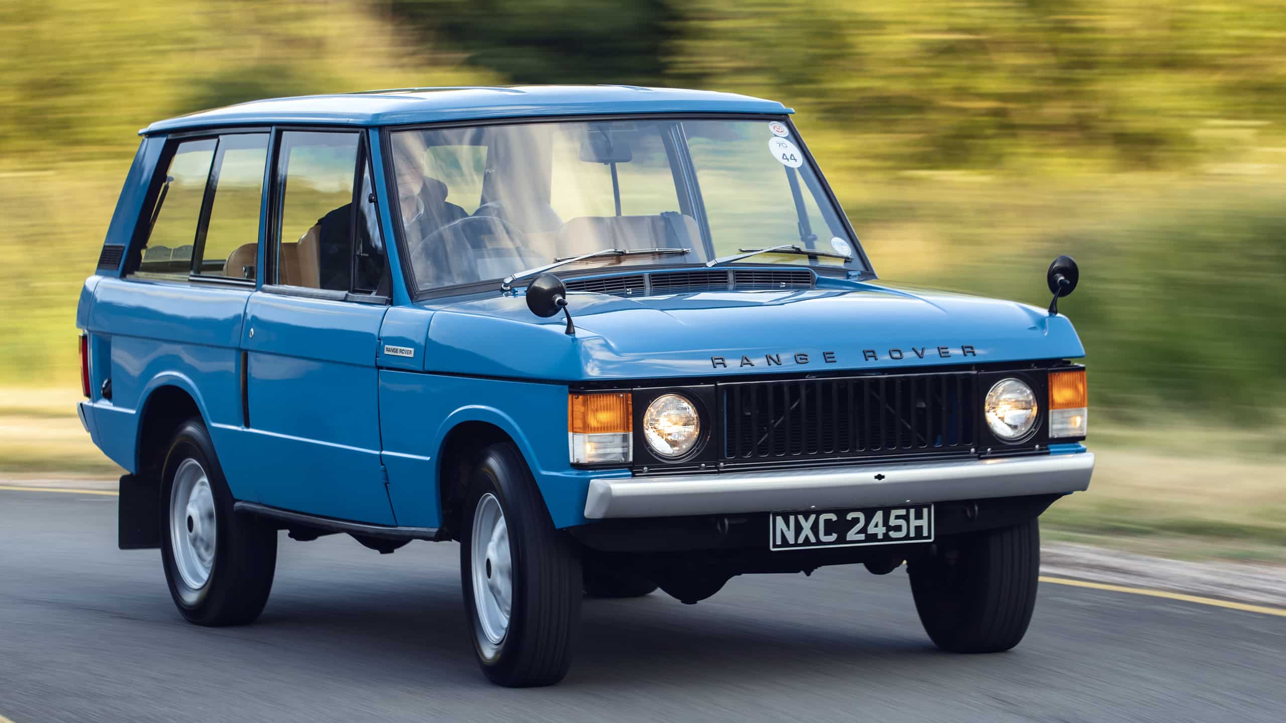 1970 classic ranger rover moving on the road