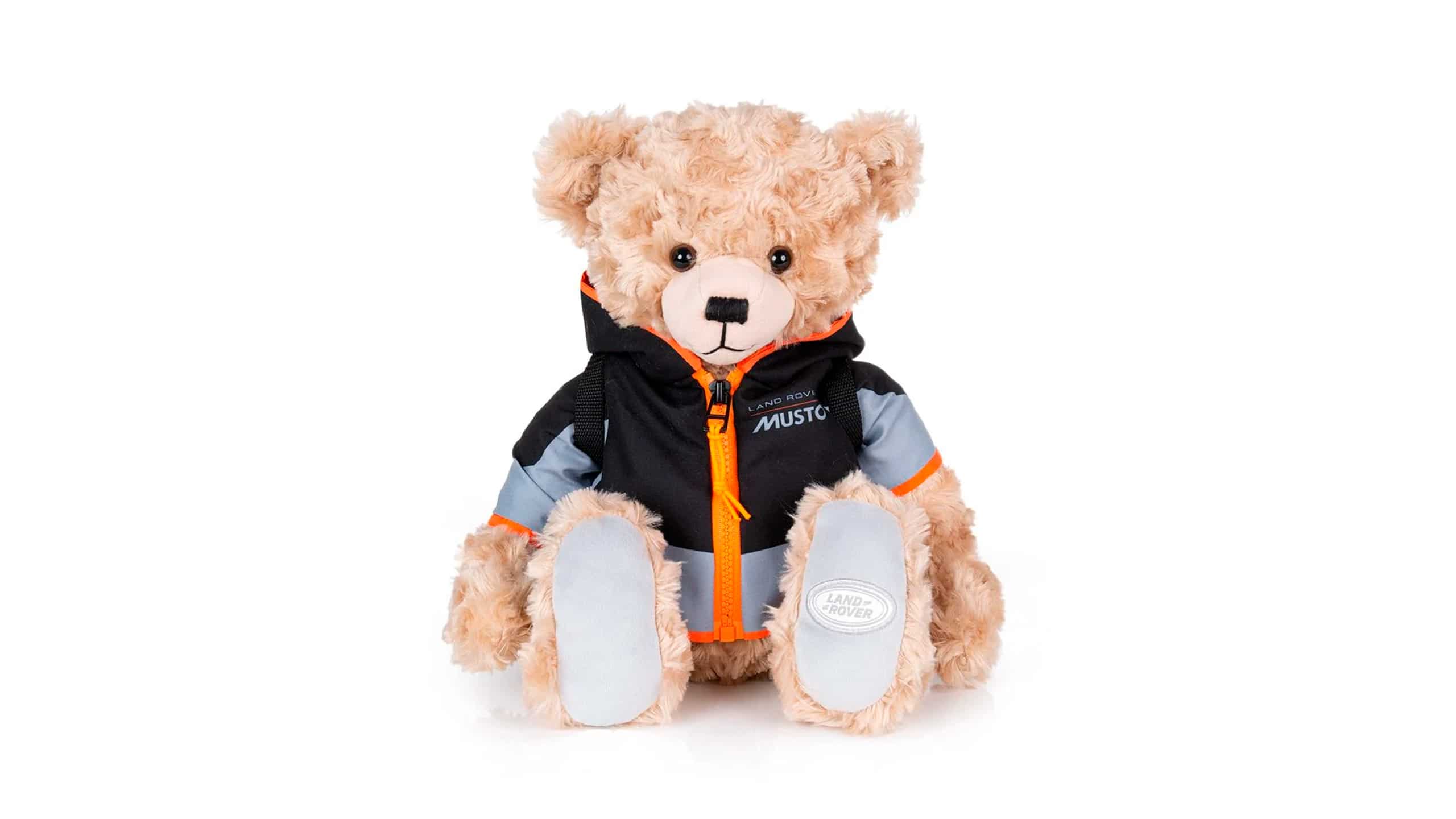 The perfect companion for little adventures. This soft-touch Adventure Bear. Wears a removable replica Land Rover x Musto jacket and removable waterproof style backpack with working zipper for extra fun.