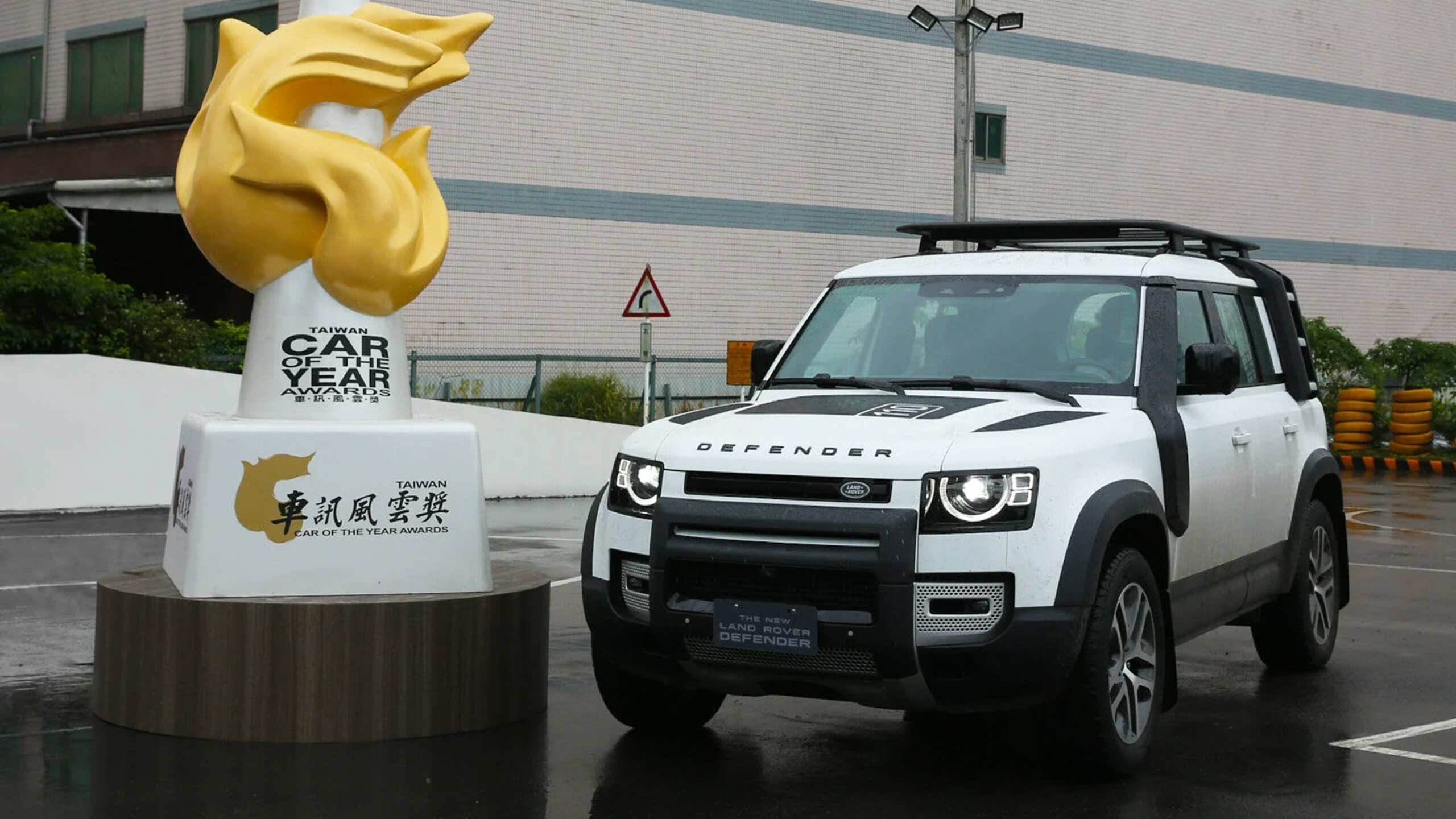 Parked Defender outside of car of the year award 